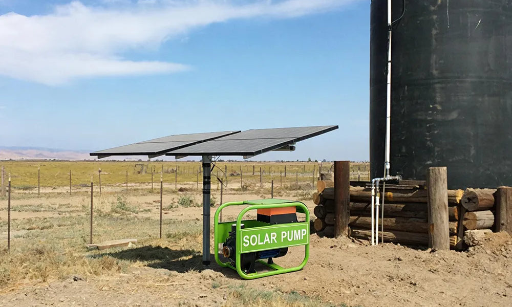 Solar panels powering a solar water pump, with a water tank for storing pumped water, providing off-grid water solutions
