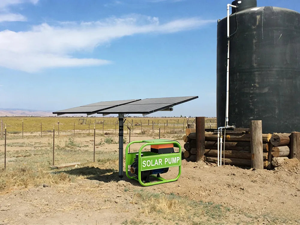 Solar panels powering a solar water pump, with a water tank for storing pumped water, providing off-grid water solutions